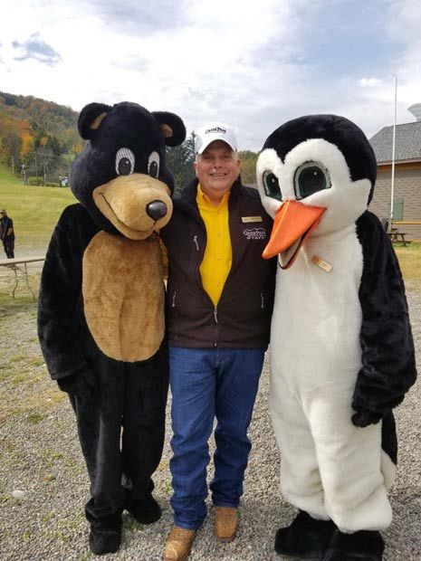Greek Peak ski resort president Wesley Kryger with mascots Arktos and Filos